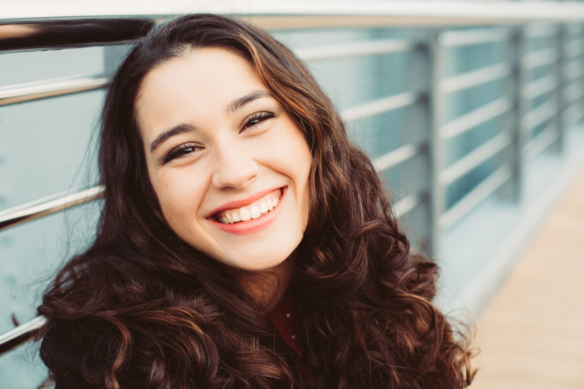 Happyand beautiful young woman laughing braces grand rapids