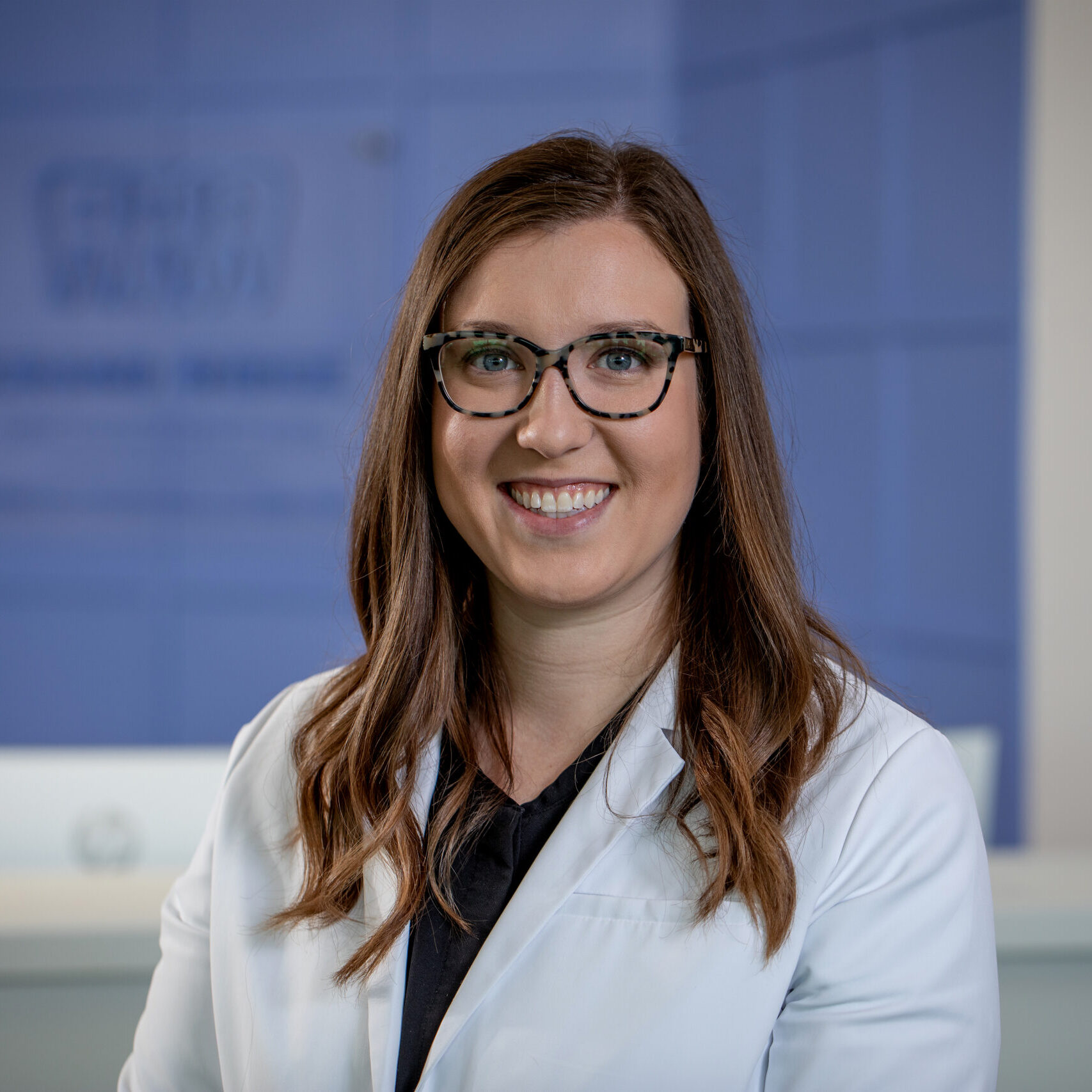 Dr. Rebecca Monticello, orthodontist at Grand Ridge Orthodontics, smiling in a professional setting, representing Grand Rapids orthodontics services.